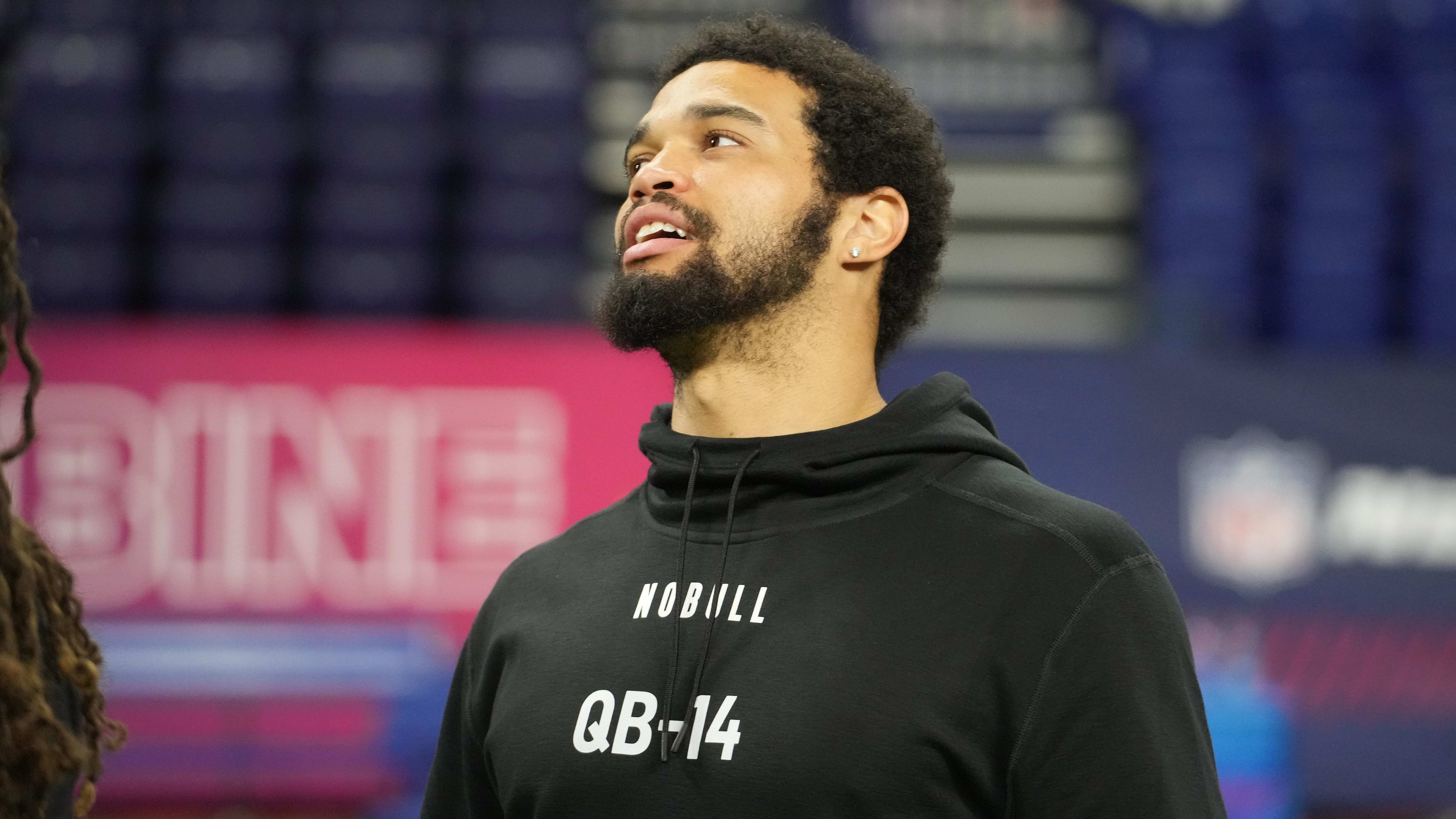 Caleb Williams watches proceedings at the combine at the beginning of March.