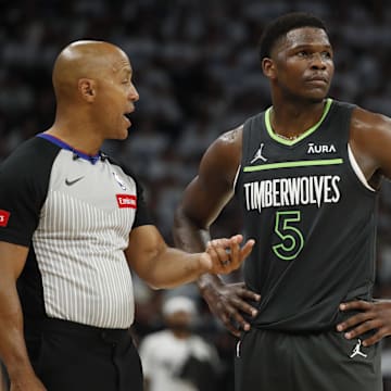 May 30, 2024; Minneapolis, Minnesota, USA; NBA referee Marc Davis (8) talks to Minnesota Timberwolves guard Anthony Edwards (5) during the second quarter in game five of the western conference finals for the 2024 NBA playoffs against the Dallas Mavericks at Target Center. Mandatory Credit: Bruce Kluckhohn-Imagn Images