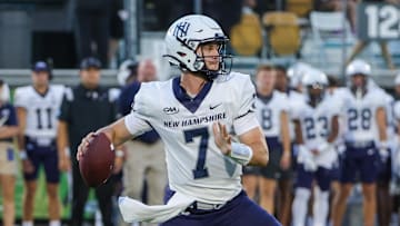 Aug 29, 2024; Orlando, Florida, USA; New Hampshire Wildcats quarterback Seth Morgan (7) looks to pass during the first quarter against the UCF Knights at FBC Mortgage Stadium. Mandatory Credit: Mike Watters-Imagn Images