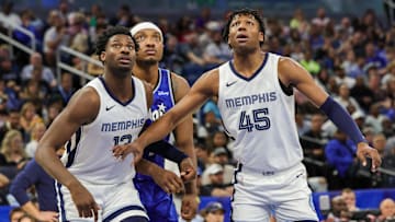 Mar 30, 2024; Orlando, Florida, USA; Memphis Grizzlies forward Jaren Jackson Jr. (13), forward GG Jackson (45) and Orlando Magic forward Paolo Banchero (5) look for the rebound during the second quarter at KIA Center. Mandatory Credit: Mike Watters-Imagn Images