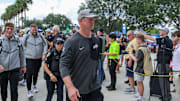 Sep 20, 2025; Orlando, Florida, USA; UCF Knights head coach Scott Frost walks into the venue before the game against the North Carolina Tar Heels at the Bounce House Stadium. Mandatory Credit: Mike Watters-Imagn Images