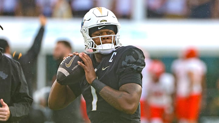 Sep 7, 2024; Orlando, Florida, USA; UCF Knights quarterback KJ Jefferson (1) warms up before the game against the Sam Houston State Bearkats at FBC Mortgage Stadium. Mandatory Credit: Mike Watters-Imagn Images