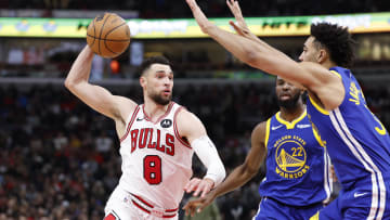 Jan 12, 2024; Chicago, Illinois, USA; Chicago Bulls guard Zach LaVine (8) drives against Golden State Warriors forward Trayce Jackson-Davis (32) during the second half at United Center. Mandatory Credit: Kamil Krzaczynski-USA TODAY Sports