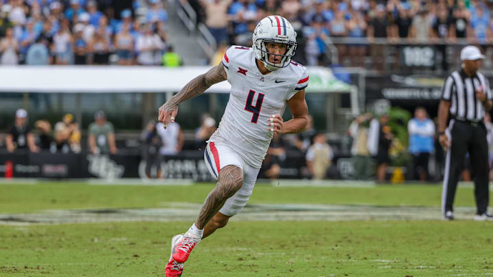 Nov 2, 2024; Orlando, Florida, USA; Arizona Wildcats wide receiver Tetairoa McMillan (4) during the second quarter against the UCF Knights at FBC Mortgage Stadium. Mandatory Credit: Mike Watters-Imagn Images Nov 2, 2024; Orlando, Florida, USA; Arizona Wildcats wide receiver Tetairoa McMillan (4) during the second quarter against the UCF Knights at FBC Mortgage Stadium. Mandatory Credit: Mike Watters-Imagn Images