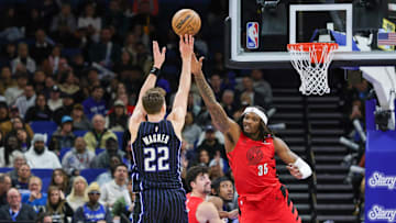 Jan 23, 2025; Orlando, Florida, USA; Orlando Magic forward Franz Wagner (22) shoots against Portland Trail Blazers center Robert Williams III (35) during the second half at Kia Center. Mandatory Credit: Mike Watters-Imagn Images