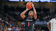 Feb 5, 2025; Orlando, Florida, USA; Cincinnati Bearcats guard Day Day Thomas (1) shoots a free throw during the first half against the UCF Knights at Addition Financial Arena. Mandatory Credit: Mike Watters-Imagn Images