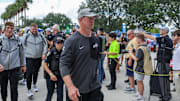 Sep 20, 2025; Orlando, Florida, USA; UCF Knights head coach Scott Frost walks into the venue before the game against the North Carolina Tar Heels at the Bounce House Stadium. Mandatory Credit: Mike Watters-Imagn Images