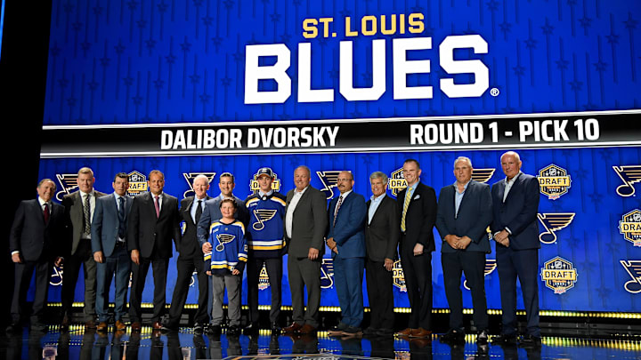 Jun 28, 2023; Nashville, Tennessee, USA; St. Louis Blues draft pick Dalibor Dvorsky stands with Blues staff after being selected with the tenth pick in round one of the 2023 NHL Draft at Bridgestone Arena. Mandatory Credit: Christopher Hanewinckel-Imagn Images