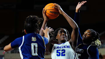 Xavier Prep forward Noelle Bofia (52) shoots against Desert Vista guard Trinity Jones (0) and forward Aniyah Riddell (25) during the Open State Championship game at Arizona Veterans Memorial Coliseum.