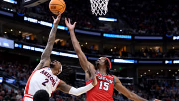 Mar 23, 2024; Salt Lake City, UT, USA; Arizona Wildcats guard Caleb Love (2) and Dayton Flyers forward DaRon Holmes II (15) fight for a rebound during the second half in the second round of the 2024 NCAA Tournament at Vivint Smart Home Arena-Delta Center. Mandatory Credit: Rob Gray-USA TODAY Sports