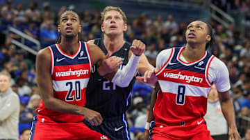 Nov 10, 2024; Orlando, Florida, USA; Washington Wizards forward Alexandre Sarr (20), guard Carlton Carrington (8) and Orlando Magic center Moritz Wagner (21) watch for the rebound during the second half at Kia Center. Mandatory Credit: Mike Watters-Imagn Images
