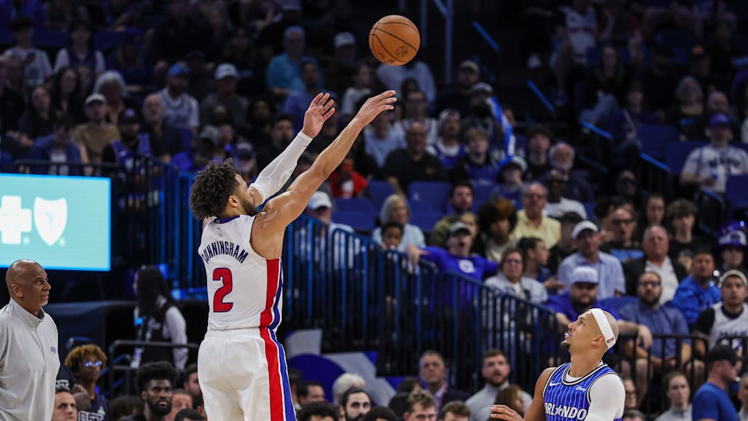 Mar 1, 2026; Orlando, Florida, USA; Detroit Pistons guard Cade Cunningham (2) shoots a three-point basket over Orlando Magic guard Jalen Suggs (4) during the second half at Kia Center. Mandatory Credit: Mike Watters-Imagn Images