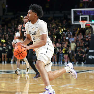 Mar 5, 2025; Orlando, Florida, USA; UCF Knights guard Dallan Coleman (6) drives to the basket during the second half against the Oklahoma State Cowboys at Addition Financial Arena. Mandatory Credit: Mike Watters-Imagn Images