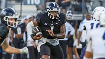 Aug 29, 2024; Orlando, Florida, USA; UCF Knights quarterback KJ Jefferson (1) runs the ball during the first quarter against the New Hampshire Wildcats at FBC Mortgage Stadium. Mandatory Credit: Mike Watters-Imagn Images