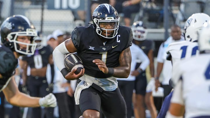Aug 29, 2024; Orlando, Florida, USA; UCF Knights quarterback KJ Jefferson (1) runs the ball during the first quarter against the New Hampshire Wildcats at FBC Mortgage Stadium. Mandatory Credit: Mike Watters-Imagn Images