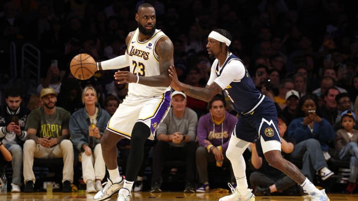 Apr 27, 2024; Los Angeles, California, USA; Los Angeles Lakers forward LeBron James (23) dribbles against Denver Nuggets guard Kentavious Caldwell-Pope (5) during the third quarter in game four of the first round for the 2024 NBA playoffs at Crypto.com Arena. Mandatory Credit: Jason Parkhurst-USA TODAY Sports