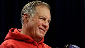Bill Belichick smiles during questions at a press conference.