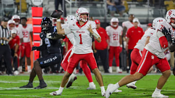 Nov 7, 2025; Orlando, Florida, USA; Houston Cougars quarterback Conner Weigman (1) drops back to pass during the first quarter against the UCF Knights at Acrisure Bounce House. Mandatory Credit: Mike Watters-Imagn Images