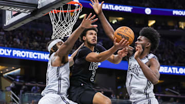 Dec 29, 2024; Orlando, Florida, USA; Orlando Magic forward Jonathan Isaac (1) and center Wendell Carter Jr. (34) block a shot by Brooklyn Nets forward Cameron Johnson (2) during the second quarter at Kia Center. Mandatory Credit: Mike Watters-Imagn Images