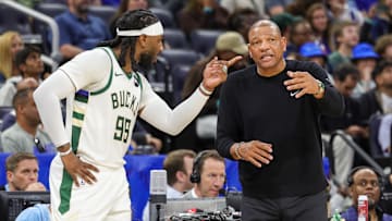 Apr 14, 2024; Orlando, Florida, USA; Milwaukee Bucks head coach Doc Rivers talks with Milwaukee Bucks forward Jae Crowder (99) during the second quarter against the Orlando Magic at KIA Center. Mandatory Credit: Mike Watters-Imagn Images