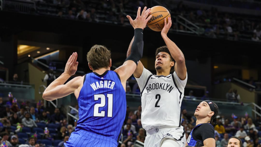 Brooklyn Nets forward Cameron Johnson (2) goes to the basket against Orlando Magic center Moritz Wagner (21) during the second half at Amway Center.