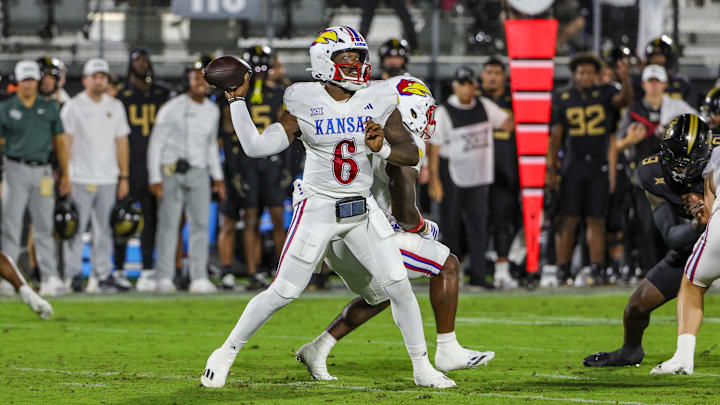 Oct 4, 2025; Orlando, Florida, USA; Kansas Jayhawks quarterback Jalon Daniels (6) throws a pass during the first quarter against the UCF Knights at FBC Mortgage Stadium. Mandatory Credit: Mike Watters-Imagn Images Oct 4, 2025; Orlando, Florida, USA; Kansas Jayhawks quarterback Jalon Daniels (6) throws a pass during the first quarter against the UCF Knights at FBC Mortgage Stadium. Mandatory Credit: Mike Watters-Imagn Images