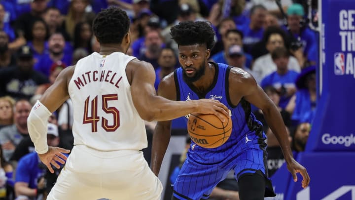 Orlando Magic forward Jonathan Isaac (1) defends Cleveland Cavaliers guard Donovan Mitchell (45) during the second quarter of game six of the first round for the 2024 NBA playoffs at Kia Center. 