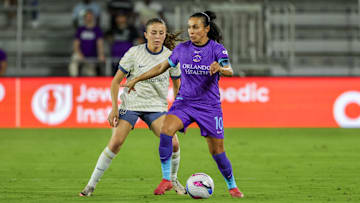 Orlando Pride forward Marta (10) handles the ball against Seattle Reign defender Madison Curry (24) during the first half at Inter&Co Stadium. Mandatory Credit: Mike Watters-Imagn Images