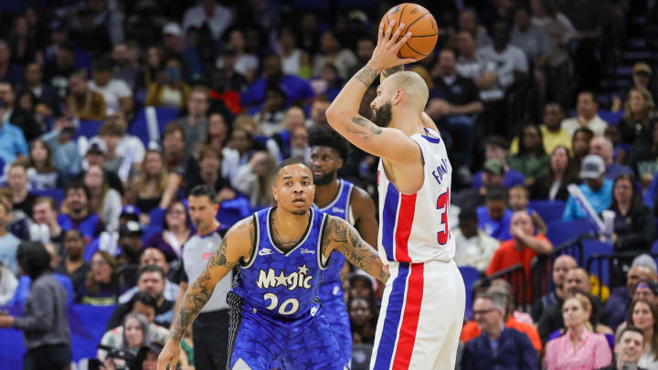 Mar 3, 2024; Orlando, Florida, USA; Orlando Magic guard Markelle Fultz (20) defends Detroit Pistons guard Evan Fournier (31) during the second quarter at KIA Center. Mandatory Credit: Mike Watters-USA TODAY Sports