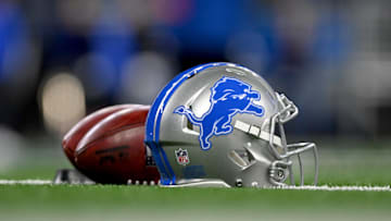 Jan 14, 2024; Detroit, Michigan, USA;  Footballs and a Detroit Lions helmet before a 2024 NFC wild card game between the Lions and Los Angeles Rams at Ford Field. Mandatory Credit: Lon Horwedel-Imagn Images