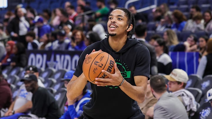 Nov 9, 2025; Orlando, Florida, USA; Boston Celtics forward Josh Minott (8) warms up before the game against the Orlando Magic at Kia Center. Mandatory Credit: Mike Watters-Imagn Images