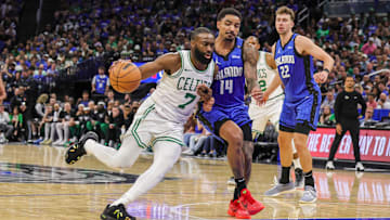 Apr 25, 2025; Orlando, Florida, USA; Boston Celtics guard Jaylen Brown (7) drives to the basket against Orlando Magic guard Gary Harris (14) during the second half of game three of first round for the 2024 NBA Playoffs at Kia Center. Mandatory Credit: Mike Watters-Imagn Images