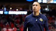 Mar 29, 2024; Dallas, TX, USA; Marquette Golden Eagles head coach Shaka Smart leaves the court after losing to the North Carolina State Wolfpack in the semifinals of the South Regional of the 2024 NCAA Tournament at American Airlines Center. Mandatory Credit: Kevin Jairaj-Imagn Images 