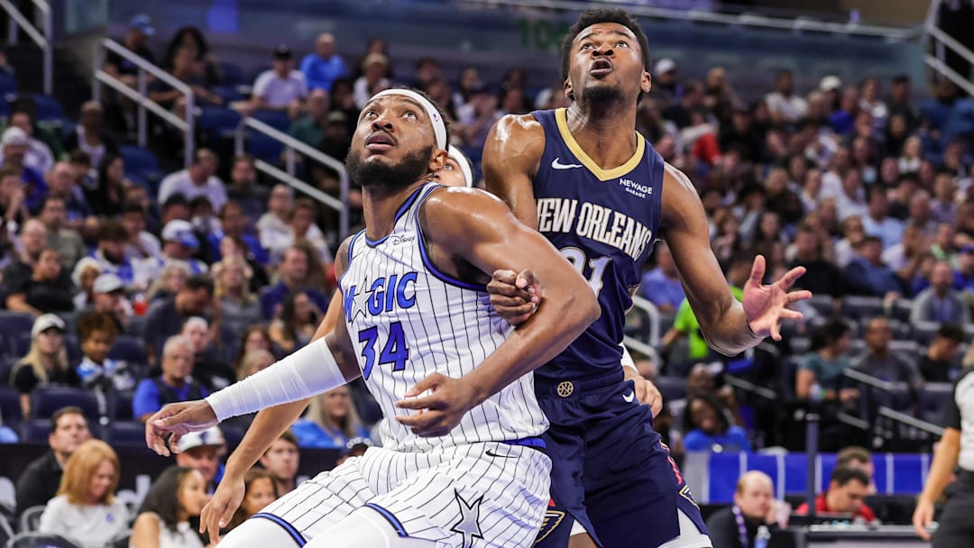 Orlando Magic center Wendell Carter Jr. (34) and New Orleans Pelicans center Yves Missi (21) look for the rebound during the second half at Kia Center. Carter is questionable to play on Sunday. Mandatory Credit: Mike Watters-Imagn Images