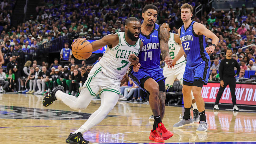 Boston Celtics guard Jaylen Brown (7) drives to the basket against Orlando Magic guard Gary Harris (14) during the second half of game three of first round for the 2024 NBA Playoffs at Kia Center.