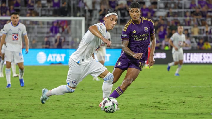 Aug 9, 2024; Orlando, Florida, USA; Cruz Azul midfielder Uriel Antuna (7) handles the ball in front of Orlando City midfielder Wilder Cartagena (16) during the second half at INTER&CO Stadium. Mandatory Credit: Mike Watters-USA TODAY Sports