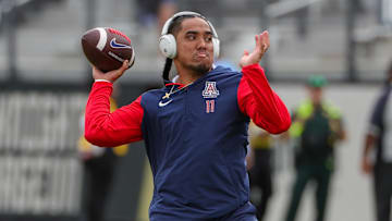 Nov 2, 2024; Orlando, Florida, USA; Arizona Wildcats quarterback Noah Fifita (11) warms up before the game against the UCF Knights at FBC Mortgage Stadium. Mandatory Credit: Mike Watters-Imagn Images