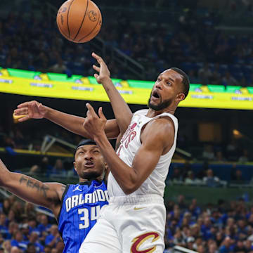 May 3, 2024; Orlando, Florida, USA; Cleveland Cavaliers forward Evan Mobley (4) and Orlando Magic center Wendell Carter Jr. (34) jump for the rebound during the first quarter of game six of the first round for the 2024 NBA playoffs at Kia Center. Mandatory Credit: Mike Watters-Imagn Images