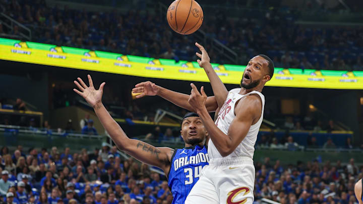 May 3, 2024; Orlando, Florida, USA; Cleveland Cavaliers forward Evan Mobley (4) and Orlando Magic center Wendell Carter Jr. (34) jump for the rebound during the first quarter of game six of the first round for the 2024 NBA playoffs at Kia Center. Mandatory Credit: Mike Watters-Imagn Images