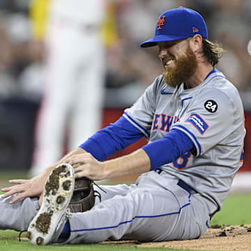 Aug 23, 2024; San Diego, California, USA; New York Mets starting pitcher Paul Blackburn (58) reacts after being hit during the third inning against the San Diego Padres at Petco Park. Mandatory Credit: Denis Poroy-Imagn Images