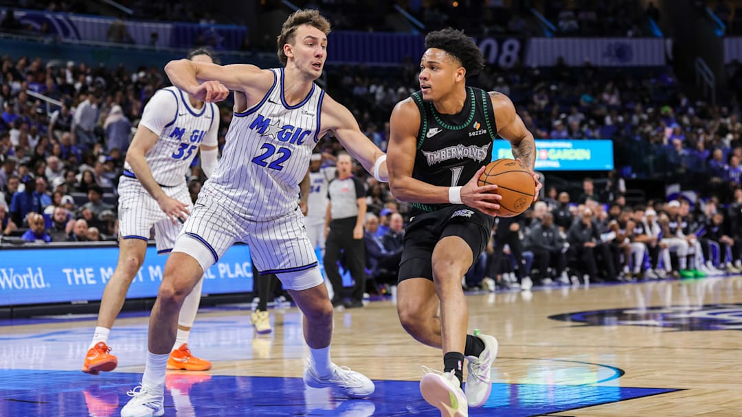 Apr 8, 2026; Orlando, Florida, USA; Minnesota Timberwolves guard Terrence Shannon Jr. (1) drives around Orlando Magic forward Franz Wagner (22) during the second quarter at Kia Center. Mandatory Credit: Mike Watters-Imagn Images