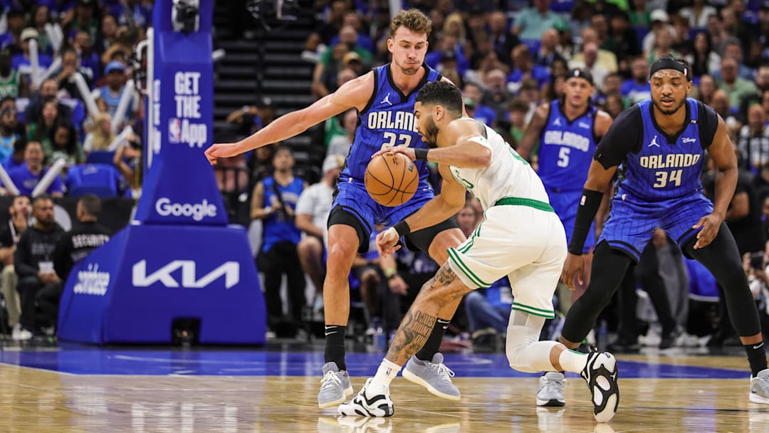 Orlando Magic forward Franz Wagner (22) defends Boston Celtics forward Jayson Tatum (0) during the first quarter of game three of first round for the 2024 NBA Playoffs at Kia Center.