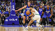 Orlando Magic forward Franz Wagner (22) defends Boston Celtics forward Jayson Tatum (0) during the first quarter of game three of first round for the 2024 NBA Playoffs at Kia Center.