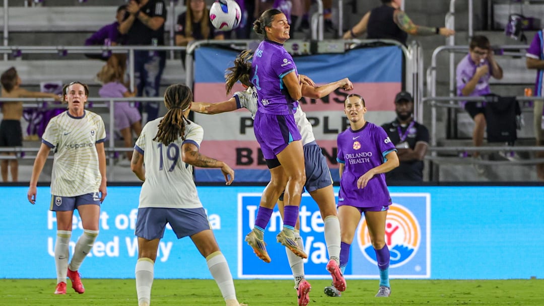 Nov 2, 2025; Orlando, Florida, USA; Orlando Pride defender Emily Sams (6) heads the ball during the first half against Seattle Reign at Inter&Co Stadium. Mandatory Credit: Mike Watters-Imagn Images