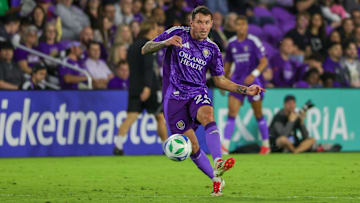 Mar 1, 2025; Orlando, Florida, USA; Orlando City defender Kyle Smith (24) kicks the ball during the second half against Toronto FC at Inter&Co Stadium. Mandatory Credit: Mike Watters-Imagn Images
