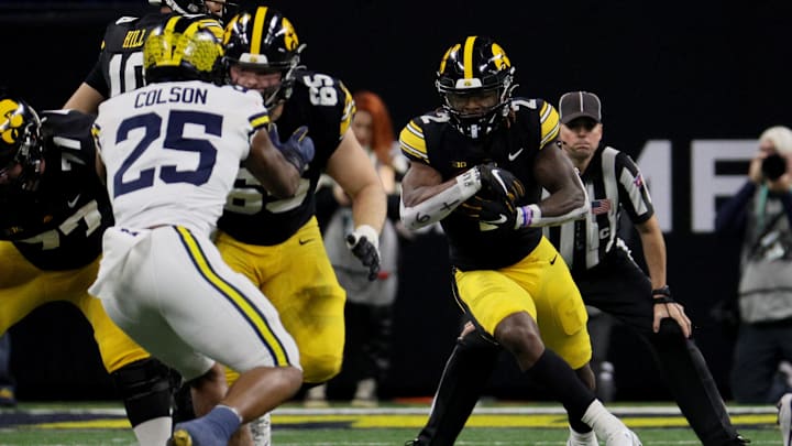 Dec 2, 2023; Indianapolis, IN, USA; Iowa Hawkeyes running back Kaleb Johnson (2) runs during the first half of the Big Ten Championship game against the Michigan Wolverines at Lucas Oil Stadium. Mandatory Credit: Trevor Ruszkowski-USA TODAY Sports