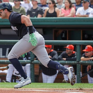Mar 13, 2025; Lakeland, Florida, USA; New York Yankees catcher Austin Wells (28) runs to first during the first inning against the Detroit Tigers at Publix Field at Joker Marchant Stadium.