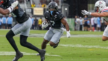 Nov 2, 2024; Orlando, Florida, USA; UCF Knights running back RJ Harvey (7) runs the ball against the Arizona Wildcats during the first quarter at FBC Mortgage Stadium. 