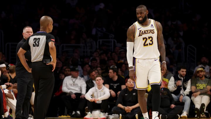 Apr 27, 2024; Los Angeles, California, USA; Los Angeles Lakers forward LeBron James (23) talks to referee Sean Corbin (33) during the second quarter in game four of the first round for the 2024 NBA playoffs against the Denver Nuggets at Crypto.com Arena. Mandatory Credit: Jason Parkhurst-USA TODAY Sports