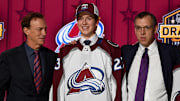 Jun 28, 2023; Nashville, Tennessee, USA; Colorado Avalanche draft pick Calum Ritchie stands with Ava staff after being selected with the twenty seventh pick in round one of the 2023 NHL Draft at Bridgestone Arena. Mandatory Credit: Christopher Hanewinckel-Imagn Images
